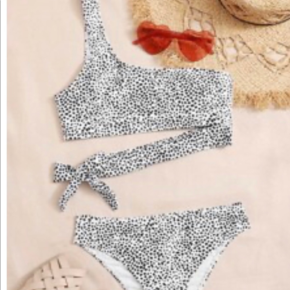 Two piece bathing suite. One shoulder.